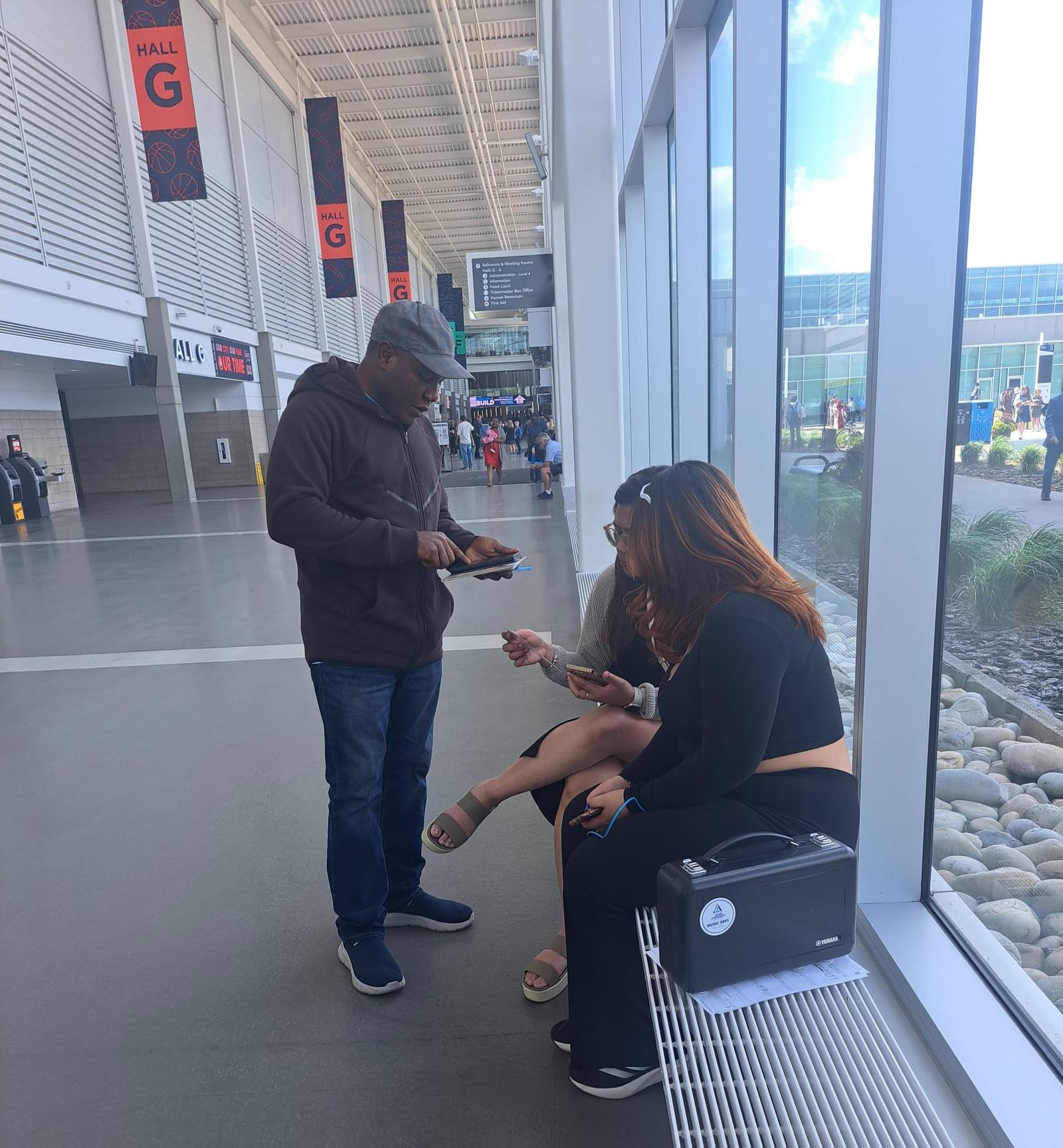 Pastor doing one-on-one evangelism at convention center