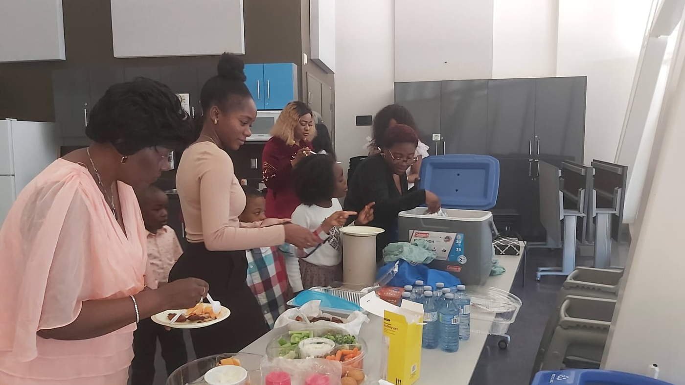 Women serving food at fellowship